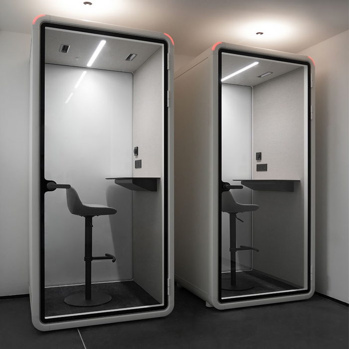 Two-person acoustic meeting pod installed in an office