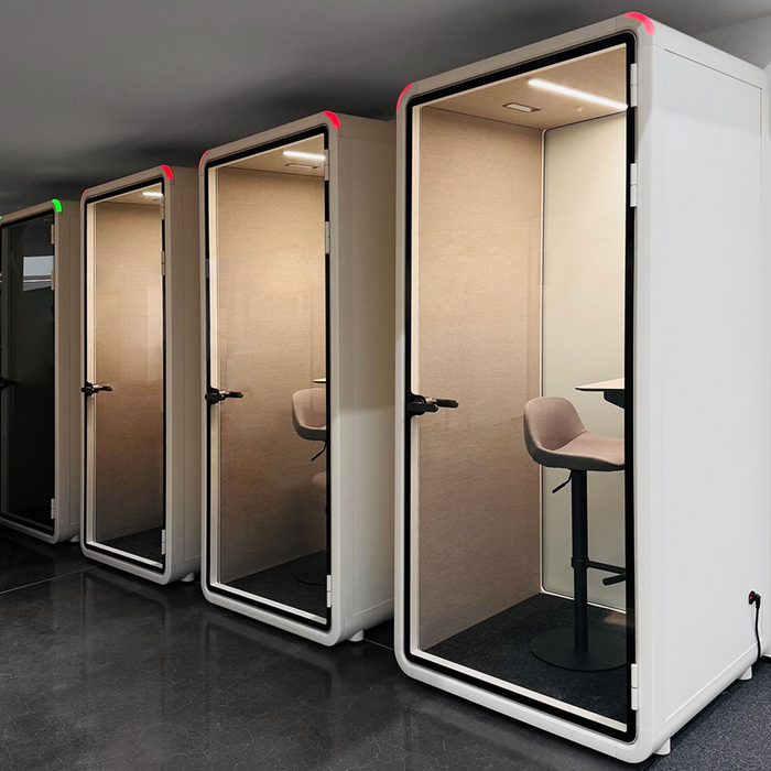 Acoustic office booth beside a desk run in an Australian office